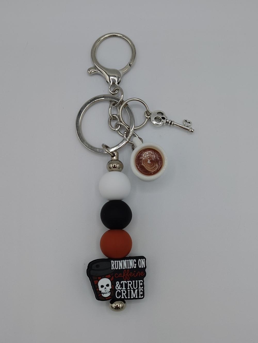 Handcrafted "Running on Caffeine & True Crime" Keychain/Bag Charm